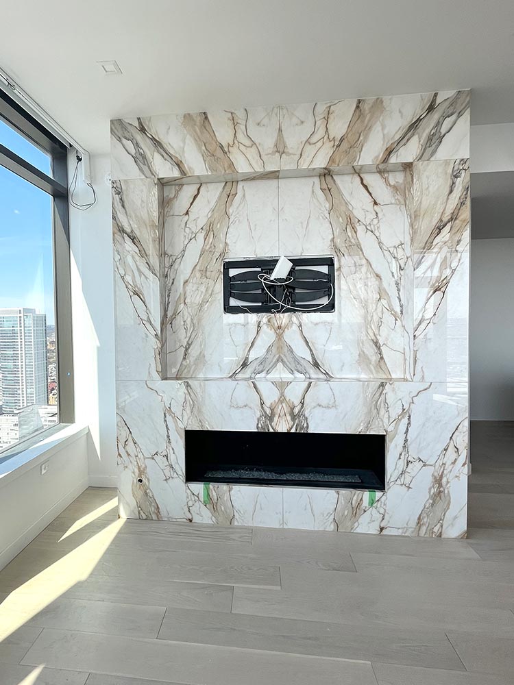 Custom Fireplace Surround - 12mm Book Matched polished porcelain slabs by Magnifica - Color: Calacatta Antique